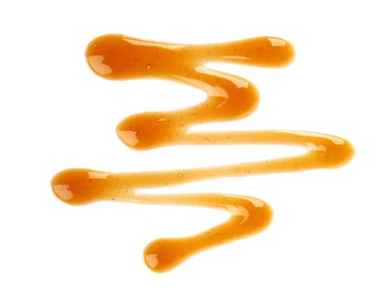 caramel-syrup-drizzle-isolated-white-splashes-sweet-caramel-sauce-top-view