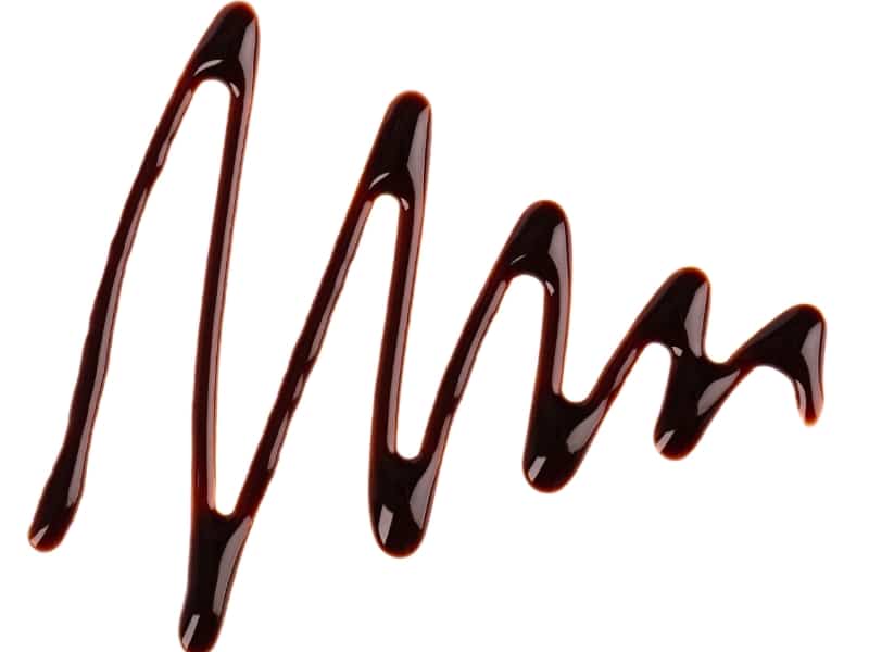 chocolate-syrup-drizzle-isolated-white-background-splashes-sweet-chocolate-sauce-top-view